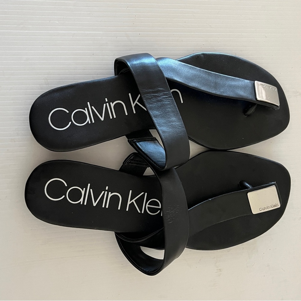 Calvin Klein Saurin Black Asymmetrical Open Toe CK Logo Plate Sandal 7.5